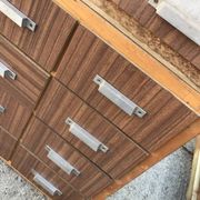 Brown wooden industrial wardrobe, multiple drawers, 1950s, workshop storage, Czech Republic.