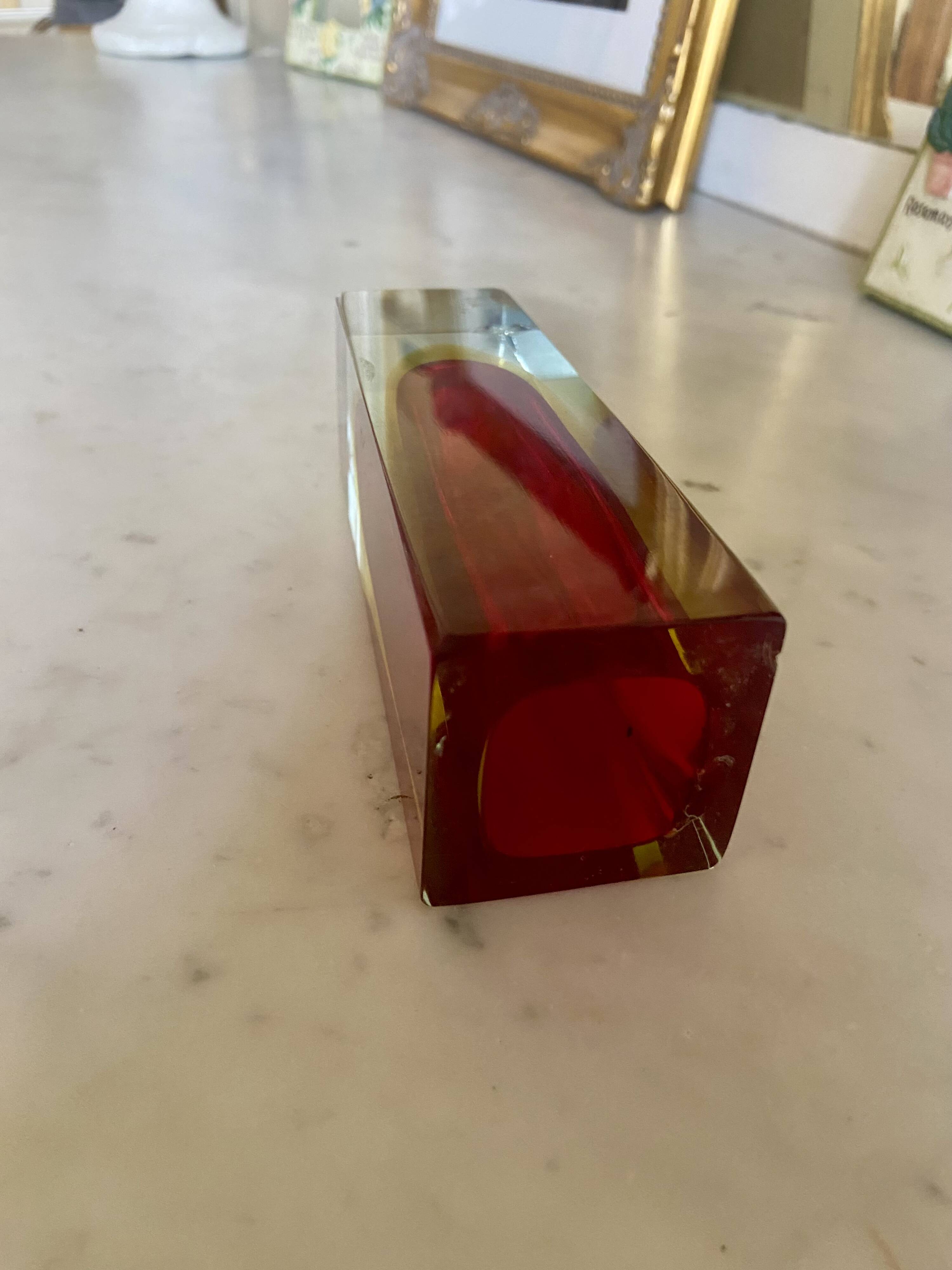 Small red vase made of Murano glass.