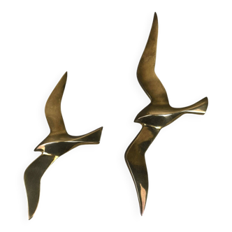 Vintage brass couple of swallows for wall decoration.