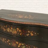 Green chest of drawers with floral decorations