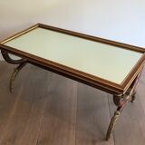 Coffee table in patinated and gilded carved wood with mirror top