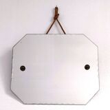 Octagonal mirror with brass hubcaps from the 60s