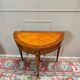 Half-moon game table in marquetry from the Louis XVI period, 18th century.