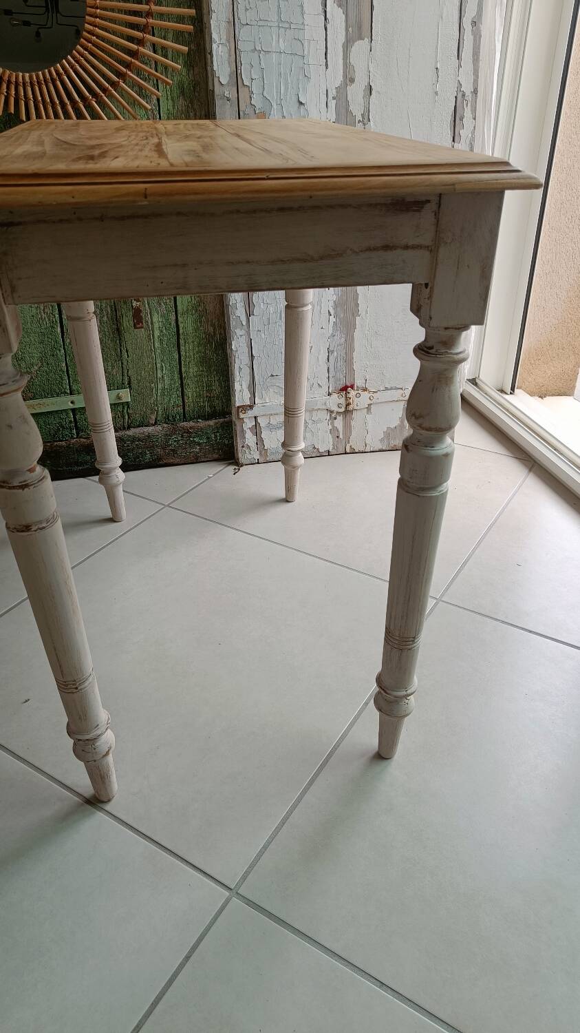 Antique wooden desk with a patinated base