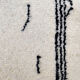Berber rug with abstract black patterns 175x240 cm