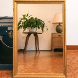 Vintage rectangular gilt mirror, molded wooden frame with beads and fire