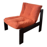 Orange velvet armchair from the 80s.