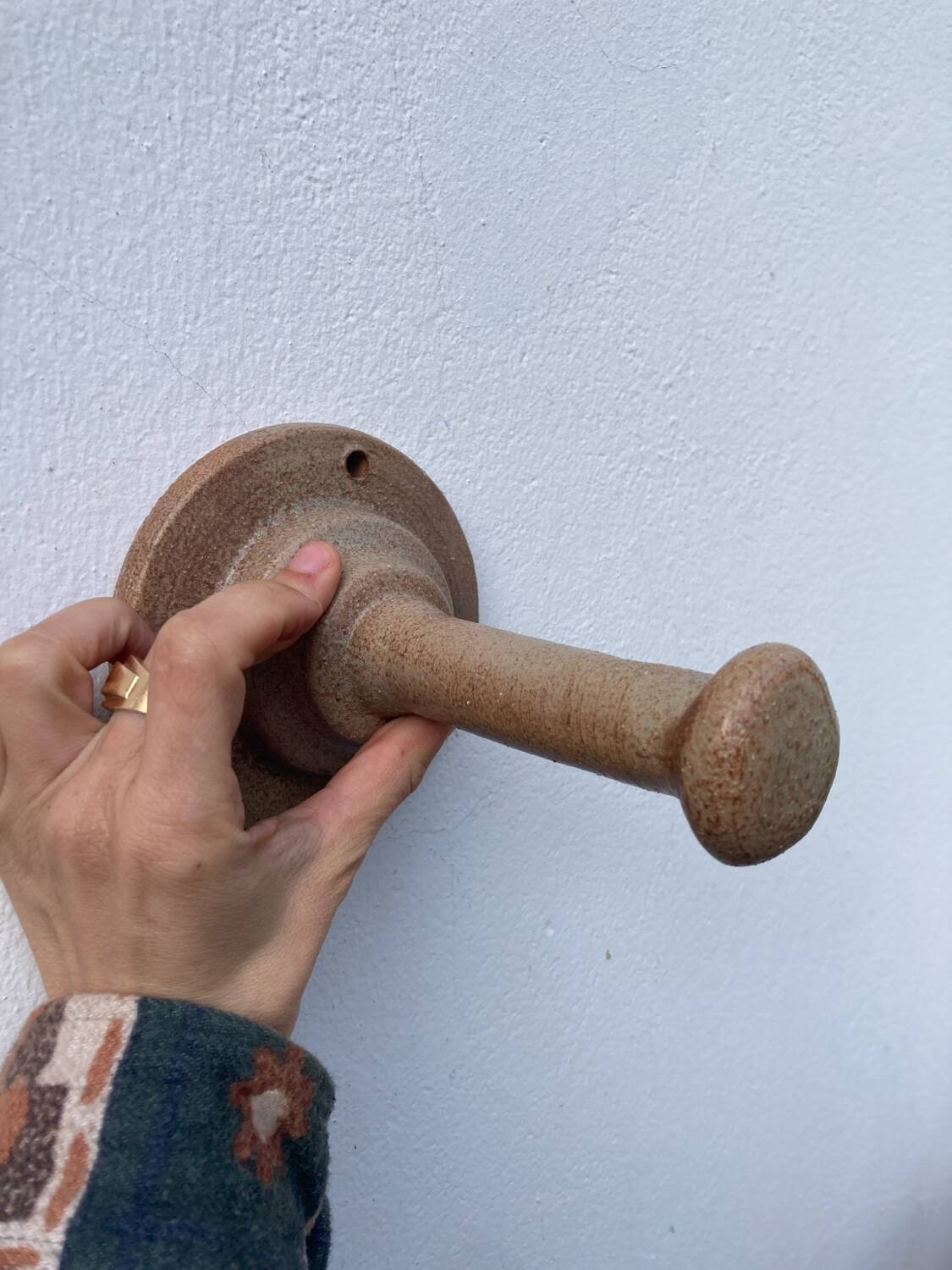 Coat hook sandstone wall light