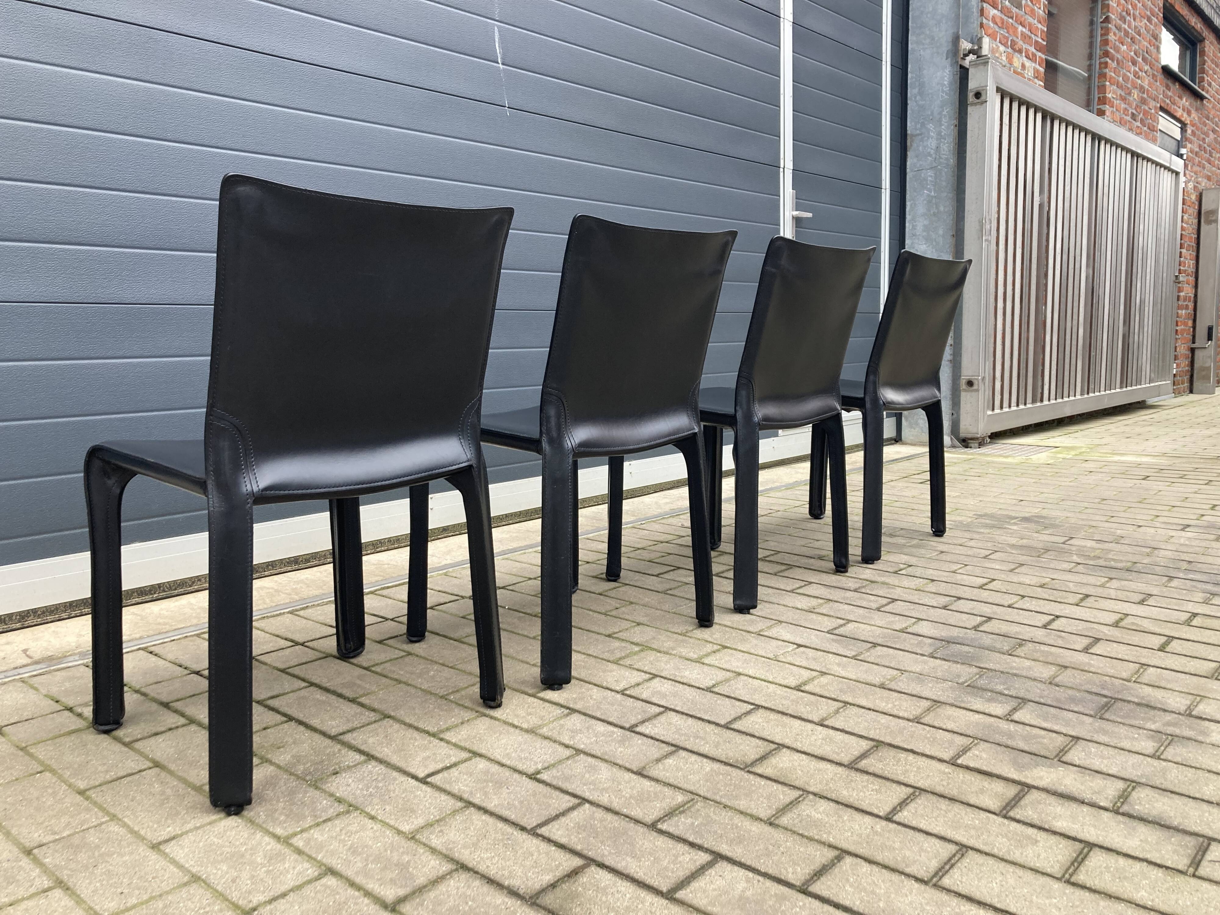 4 black Cassina Cab chairs by Mario Bellini