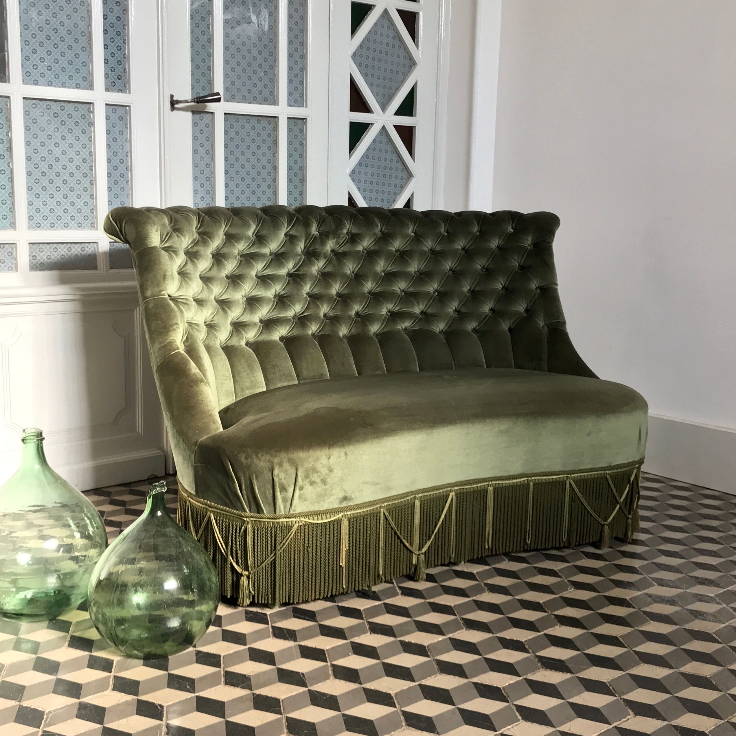 Toad in green velvet sofa
