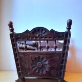Carved wooden dolls cradle