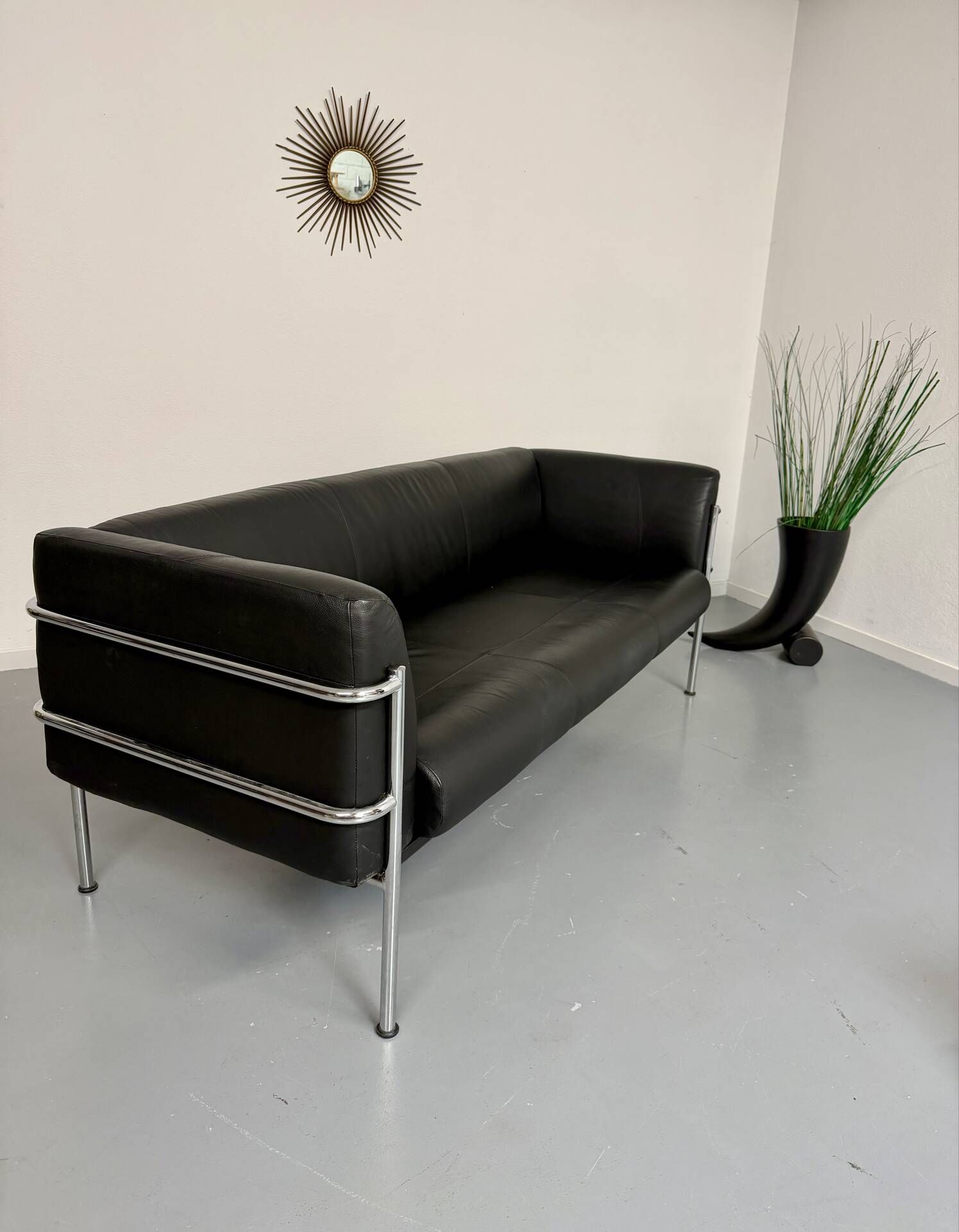 Three-seater tubular chrome and black leather sofa by Kébé, Denmark 80