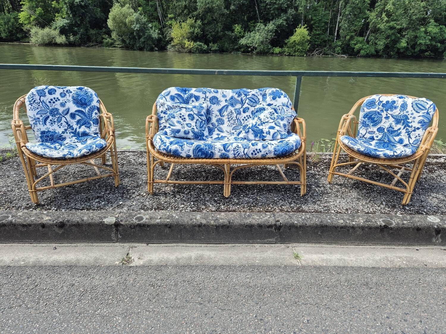 Rattan lounge with two armchairs and a vintage 1950s bench.