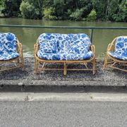 Rattan lounge with two armchairs and a vintage 1950s bench.