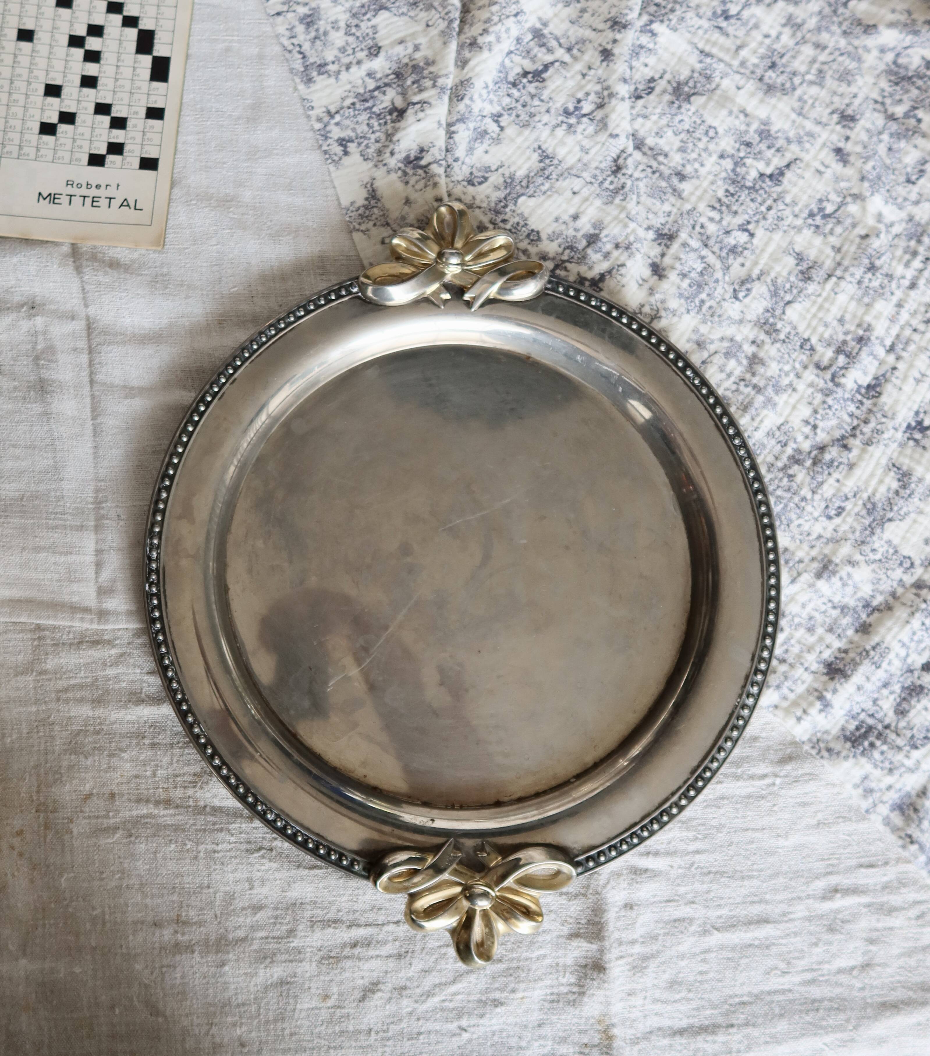 Vintage round silver metal serving tray with gold knot handles