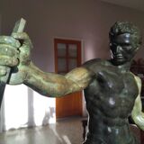 bronze sculpture athlete bending an iron bar by Jean de Roncourt on an art deco marble base