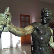 bronze sculpture athlete bending an iron bar by Jean de Roncourt on an art deco marble base