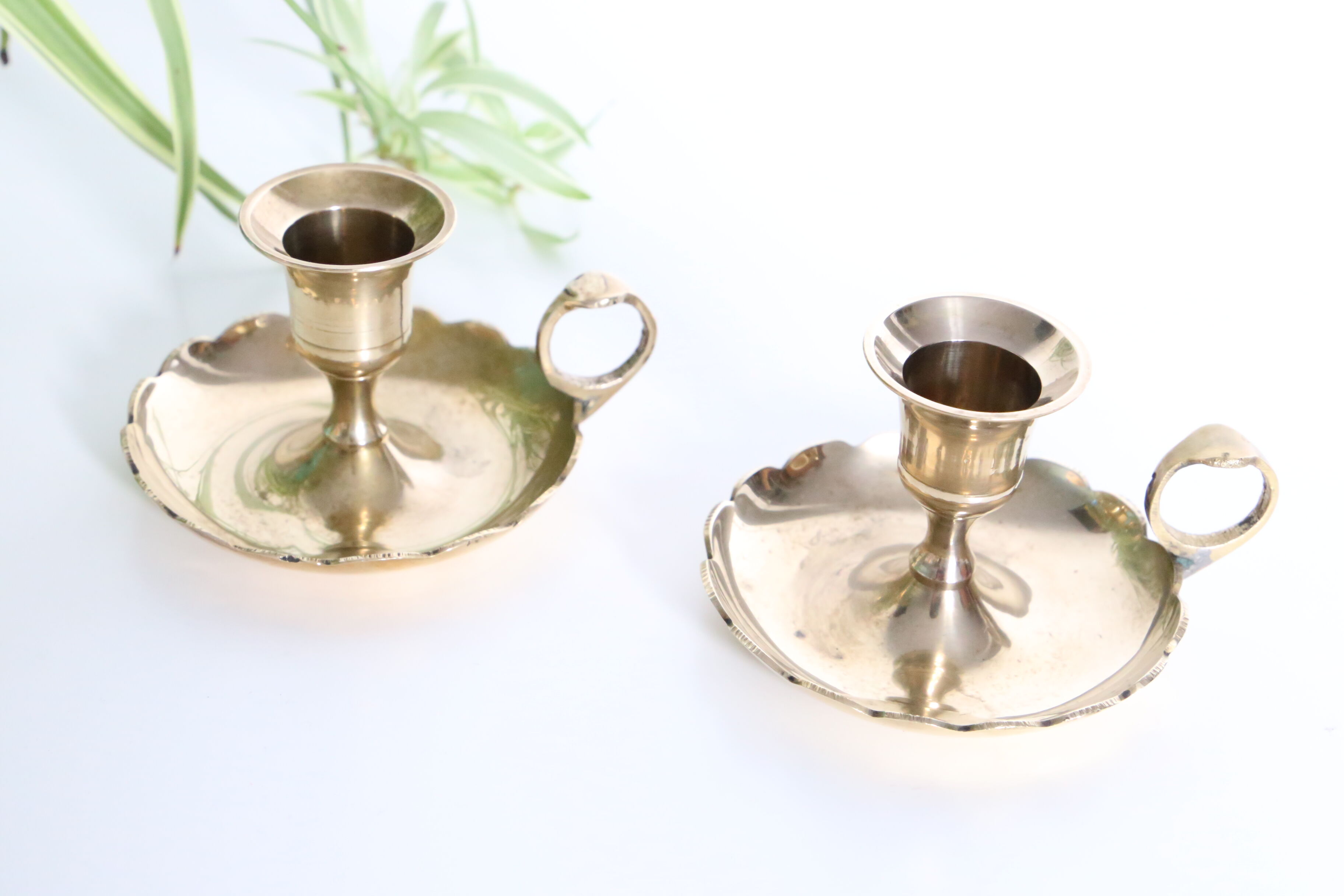 Duo of rat candlesticks in gilded brass