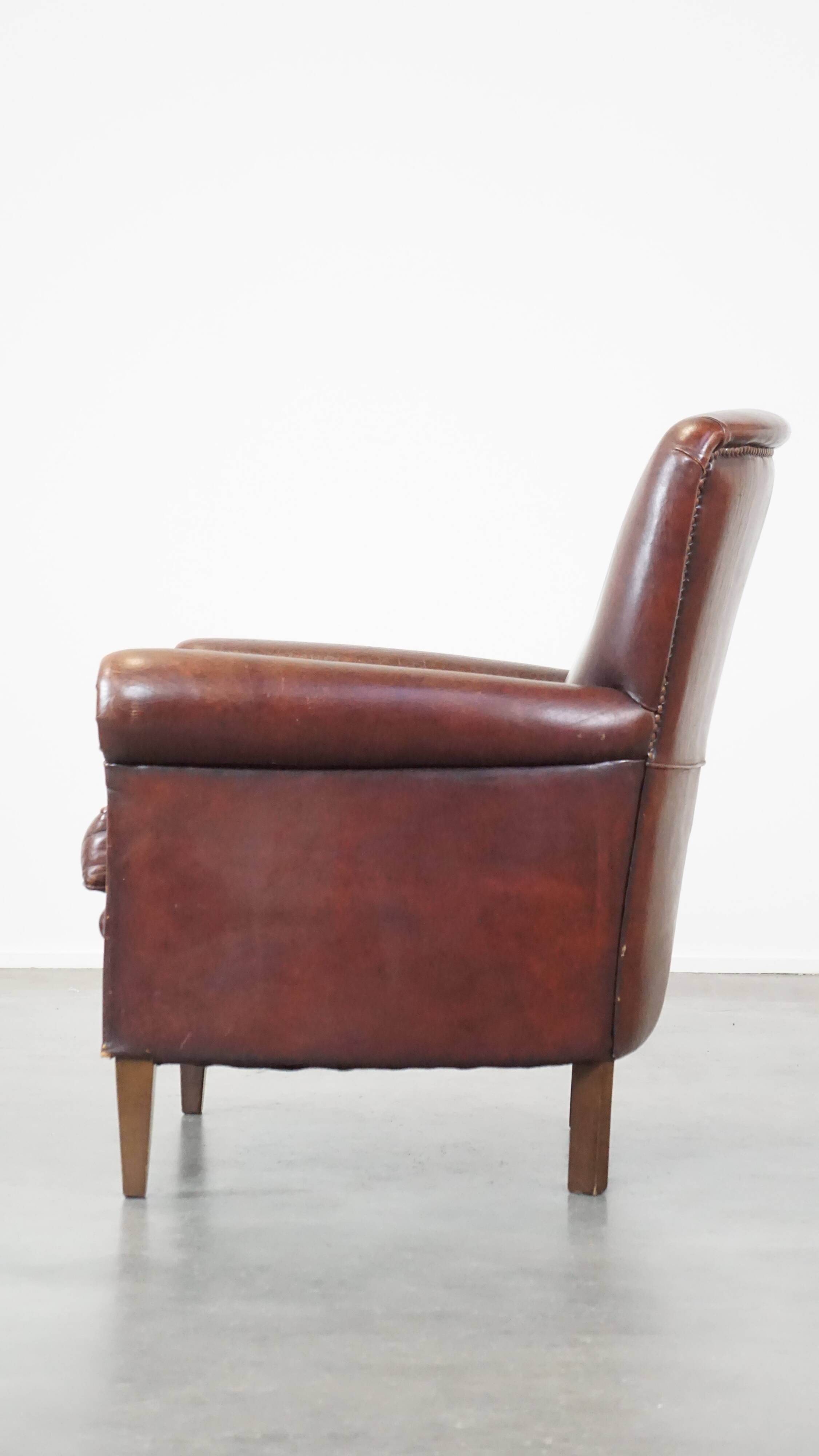 Sheep leather armchair correctly finished with decorative nails