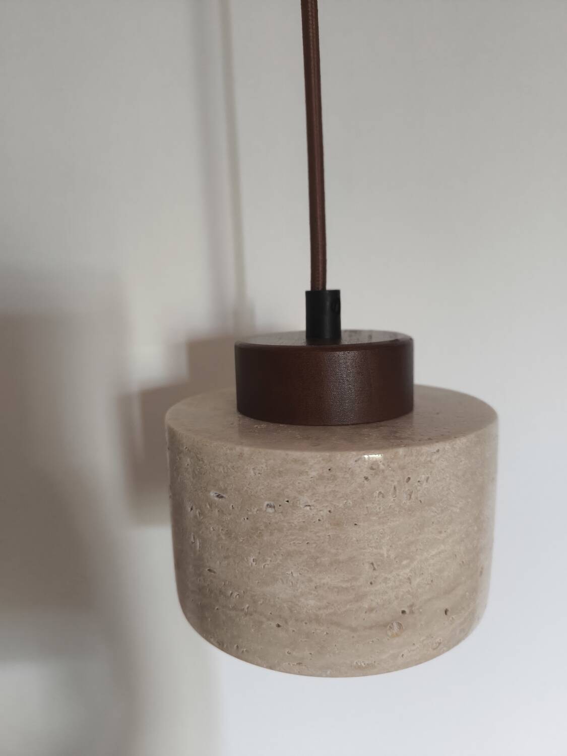 Travertine suspension