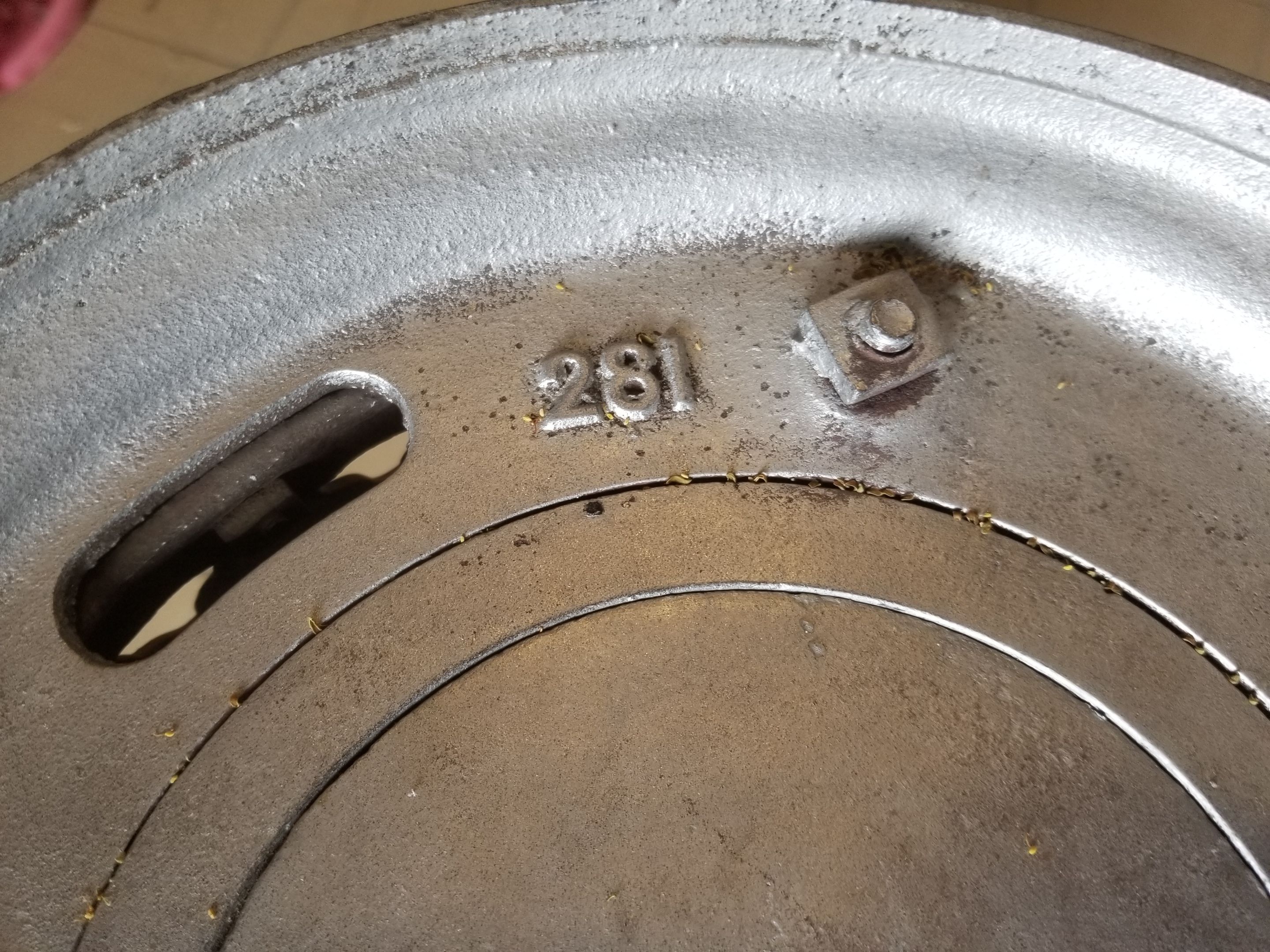 Old compact wood stove in enamelled cast iron with tripod feet with Lion's legs