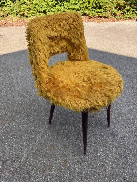 Old mustard furry armchair