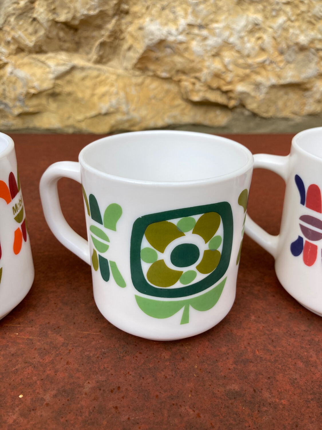 Three Mobil cups