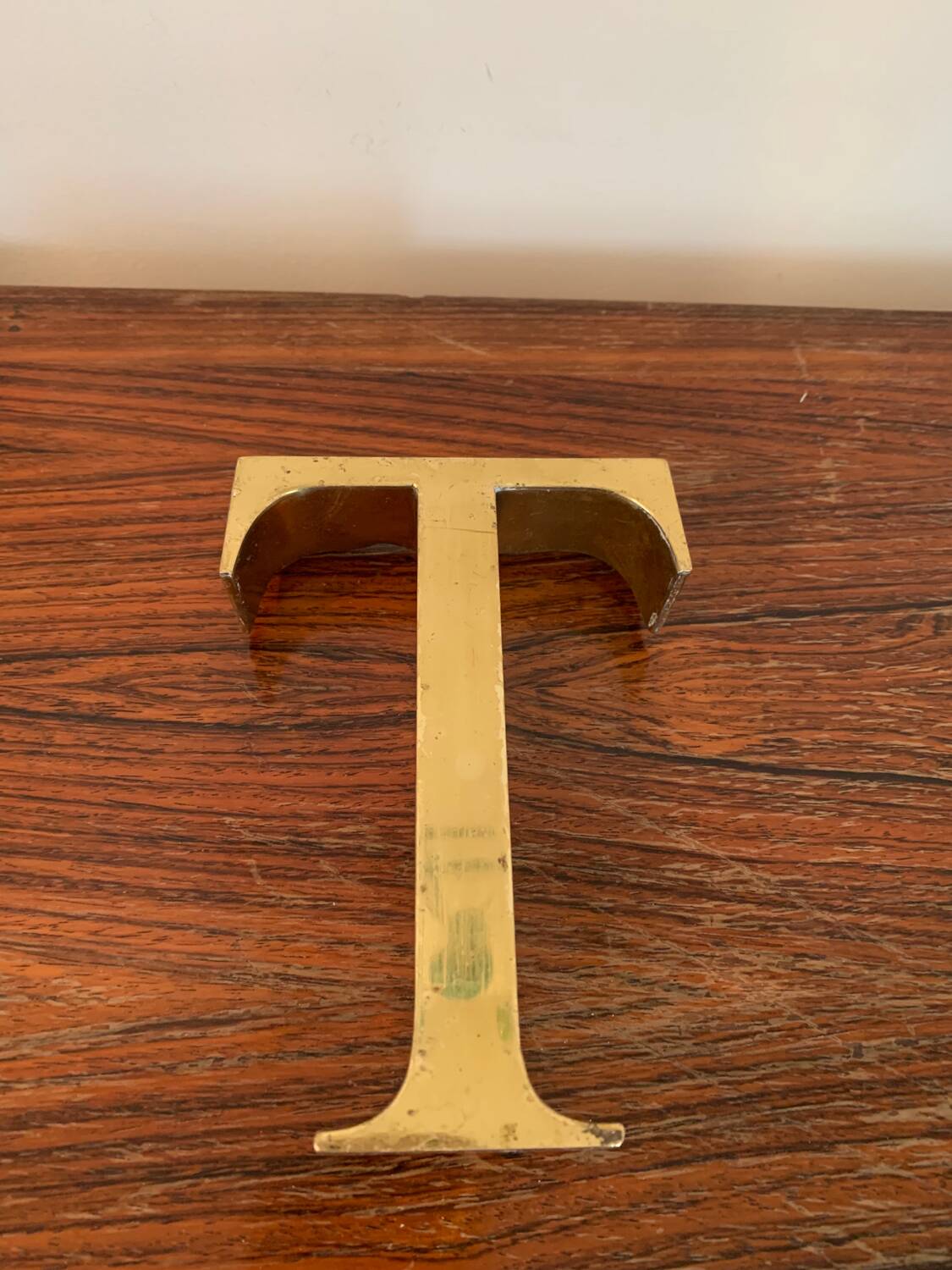Golden sign letter “T”