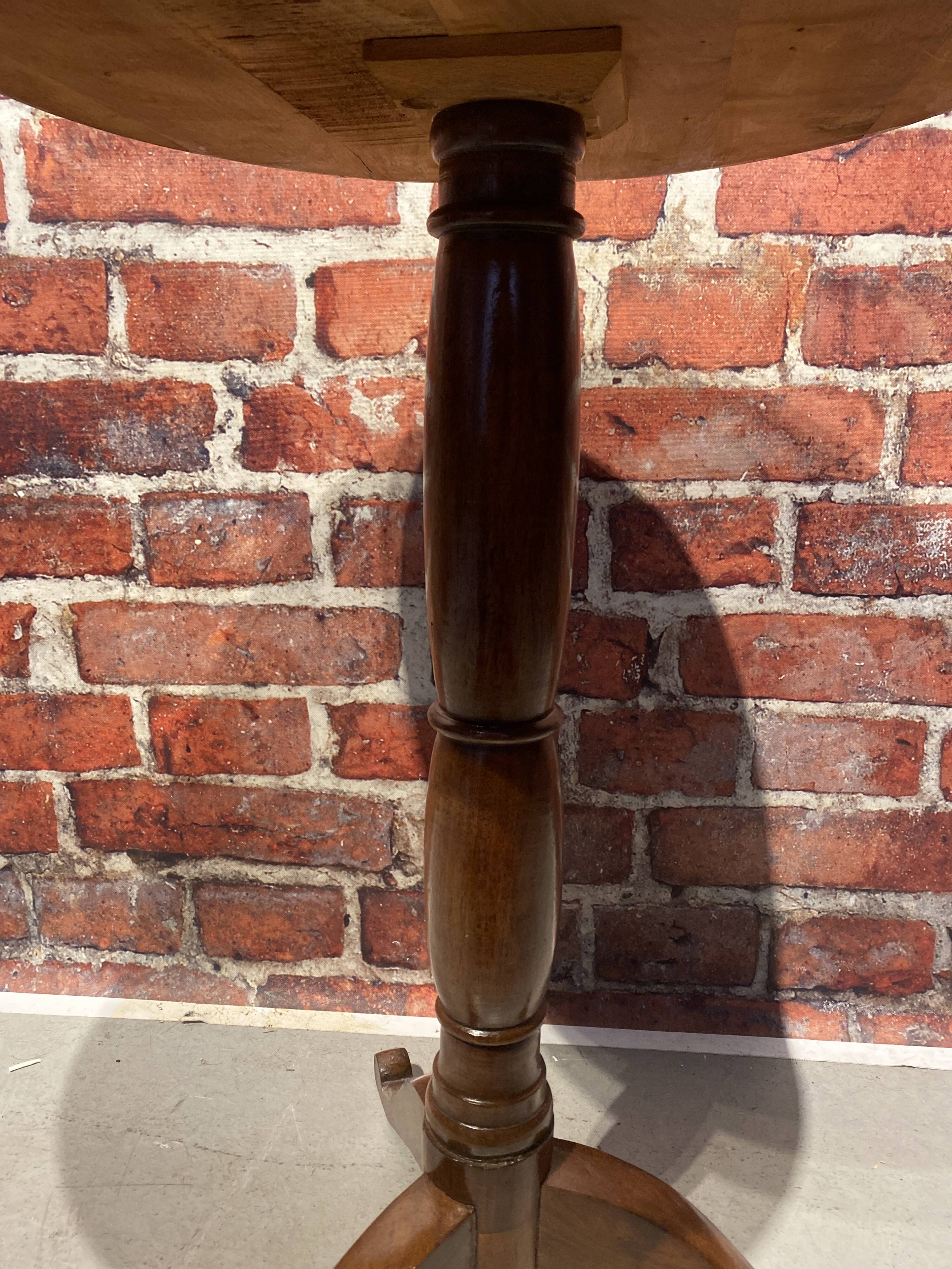 Wooden pedestal table