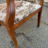 Louis XV Voltaire armchair in solid wood and floral fabric.