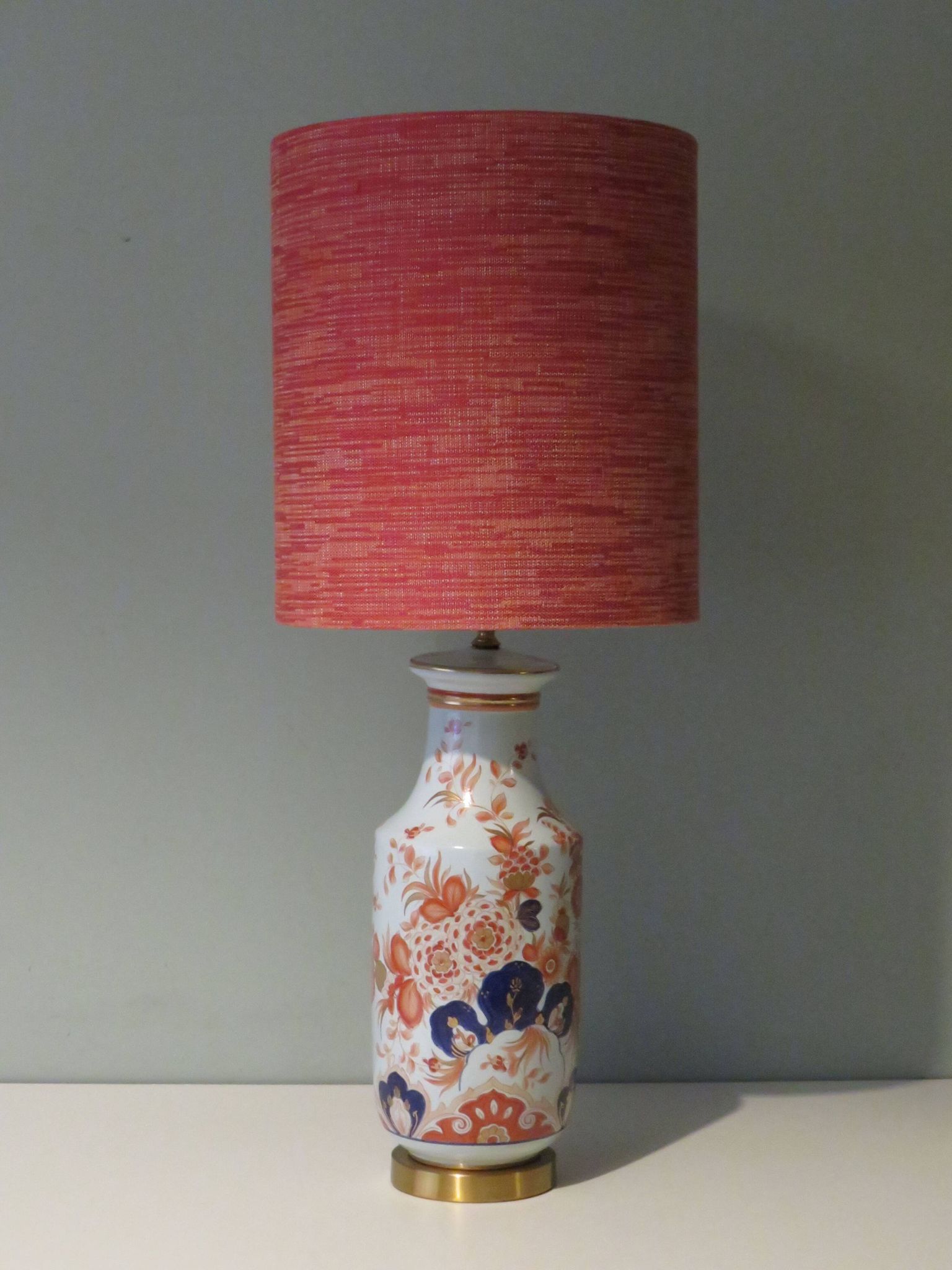 Vintage ceramic table lamp with an Imari-inspired pattern.