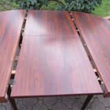 Round table with integrated extensions, rosewood. 1970