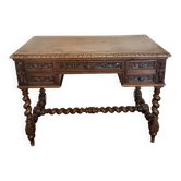 Bureau plat Louis XIII en chêne sculpté, pieds torsadés, fin XIXe