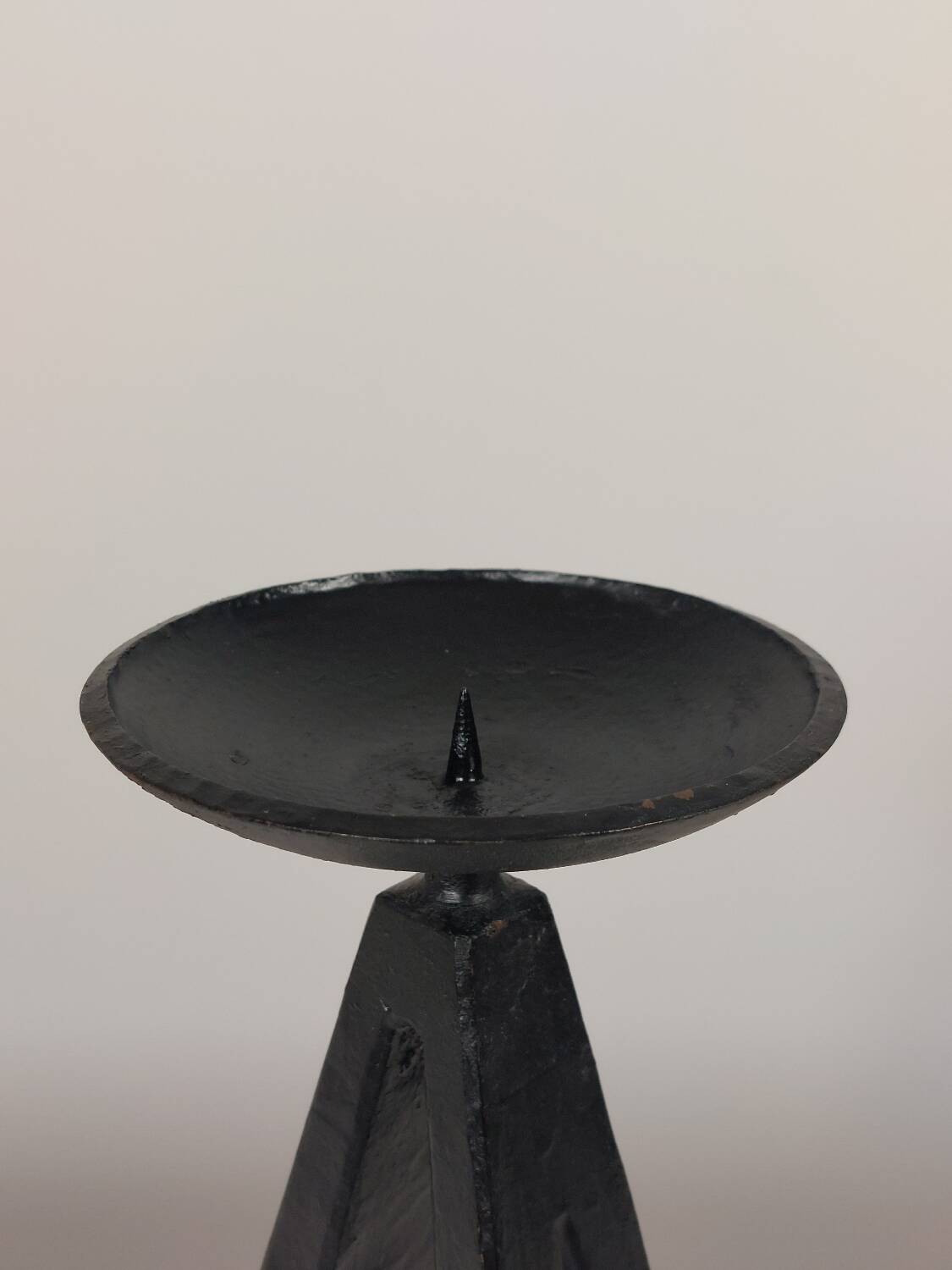 Vintage candle holder made of hand-forged metal, in a brutalist style.