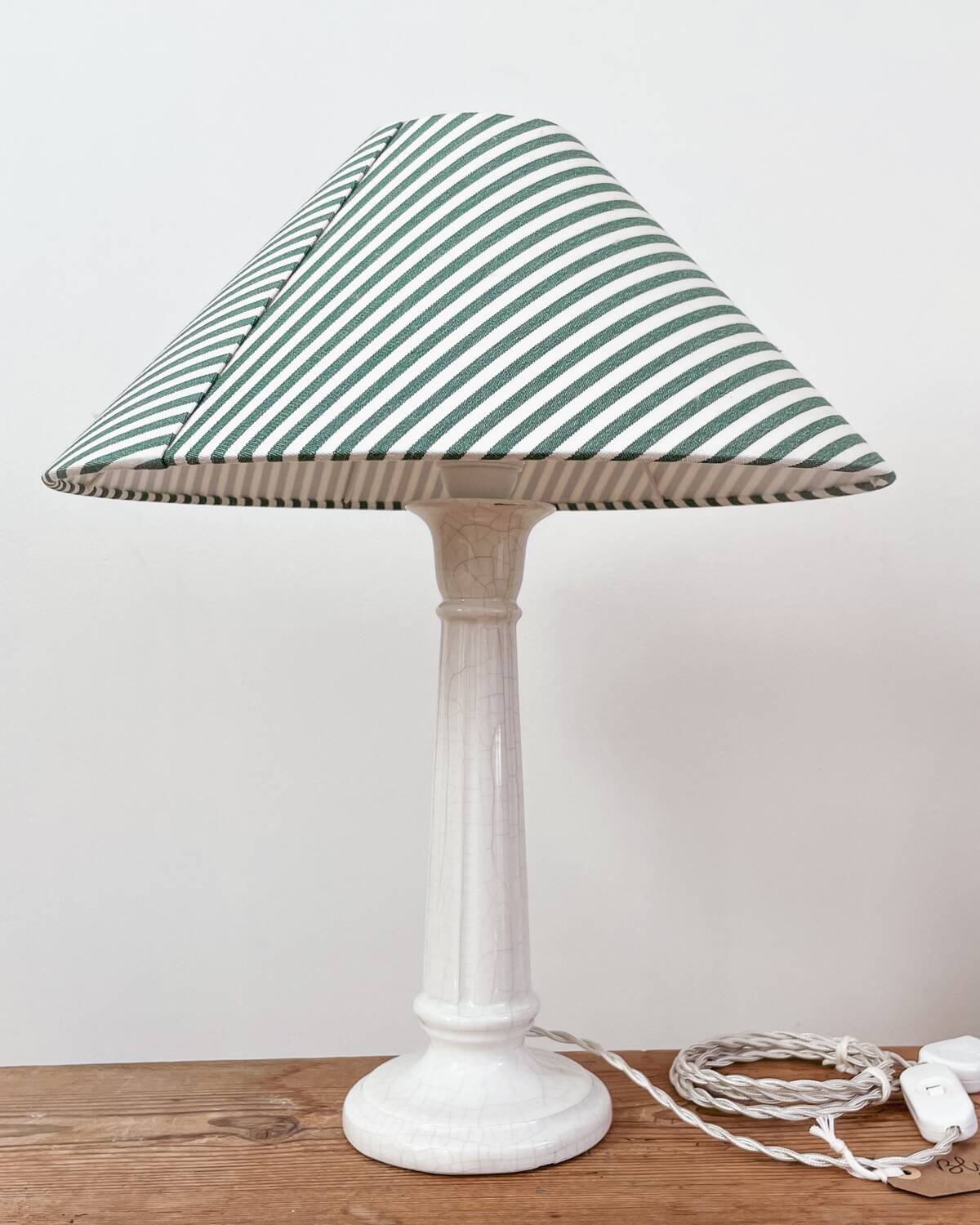Earthenware lamp and striped lampshade
