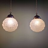 Art Deco trio of frosted glass pendants, 1920s-30s.