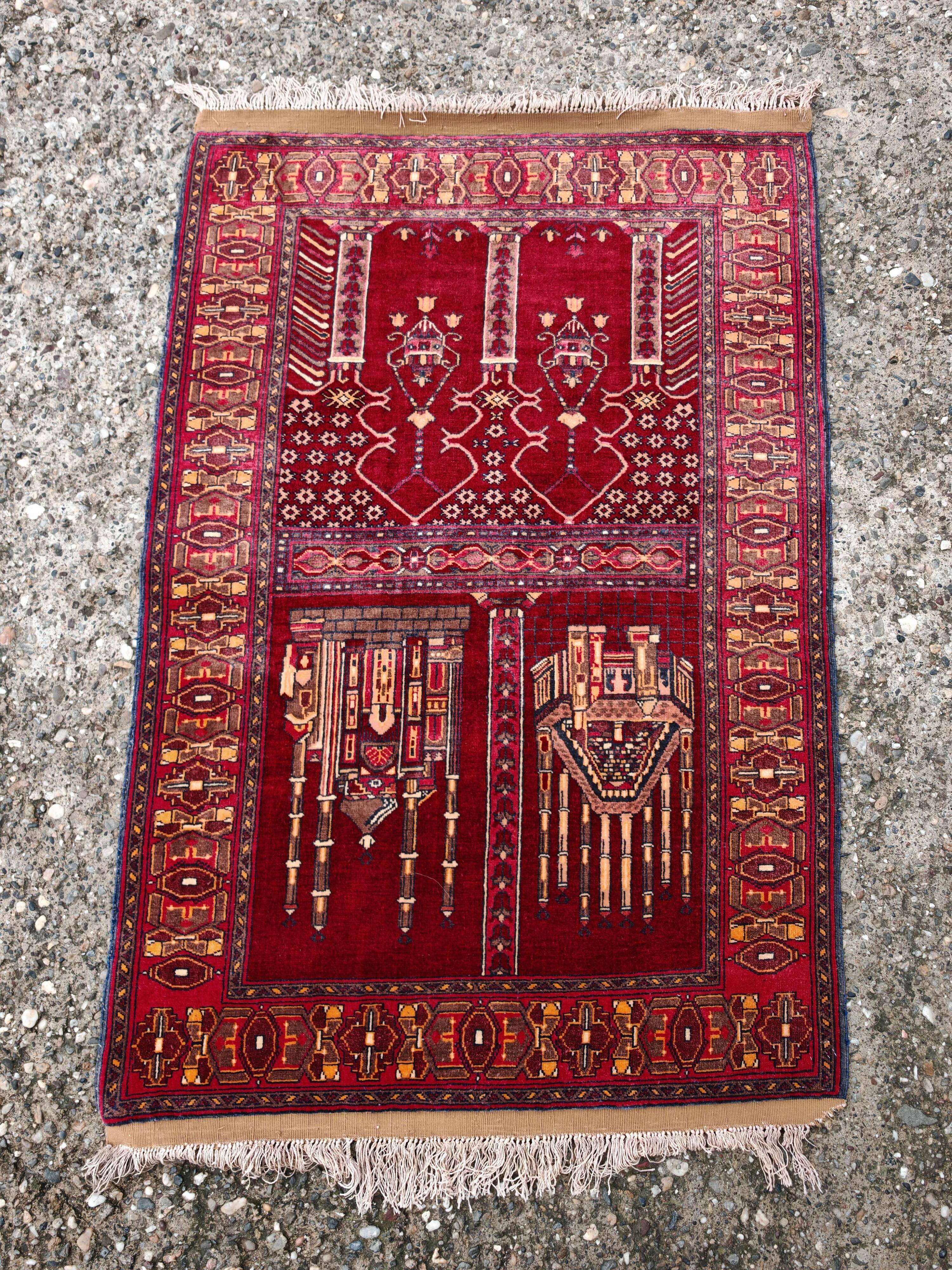 Vintage Afghan hand-knotted prayer rug with Islamic patterns.