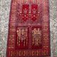 Vintage Afghan hand-knotted prayer rug with Islamic patterns.