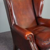 Leather armchair with decorative nails