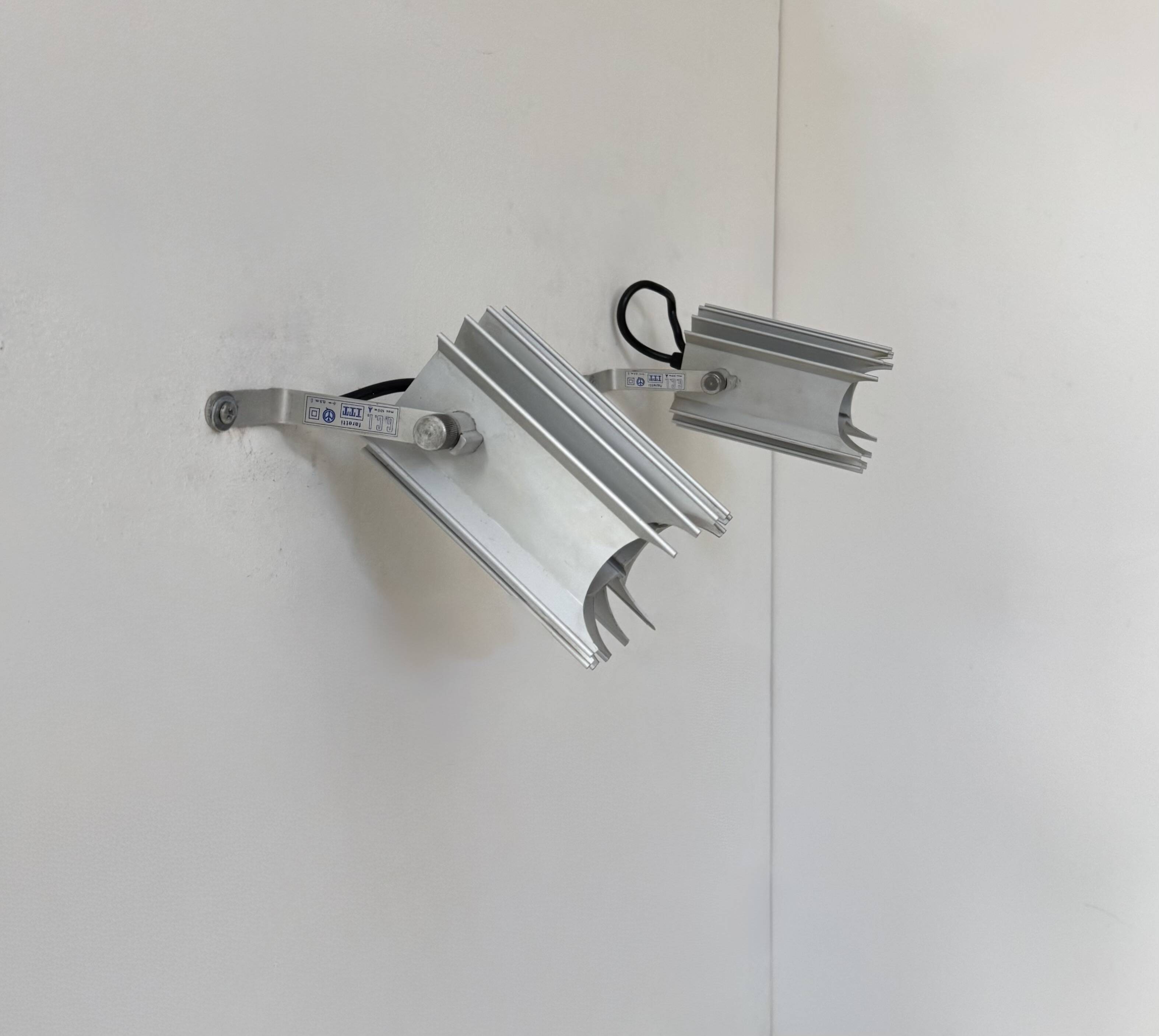 Pair of vintage wall lights, aluminium cast, Italy, 1980.
