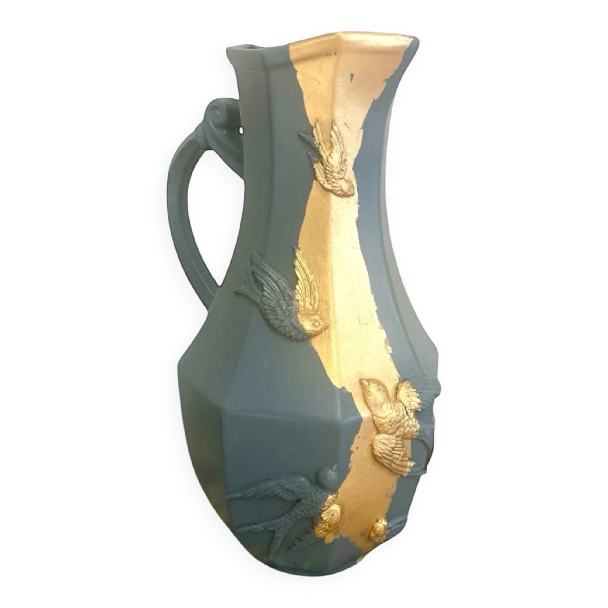 Large decorative blue-grey pitcher with swallow mouldings and gold leaf.