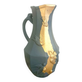 Large decorative blue-grey pitcher with swallow mouldings and gold leaf.