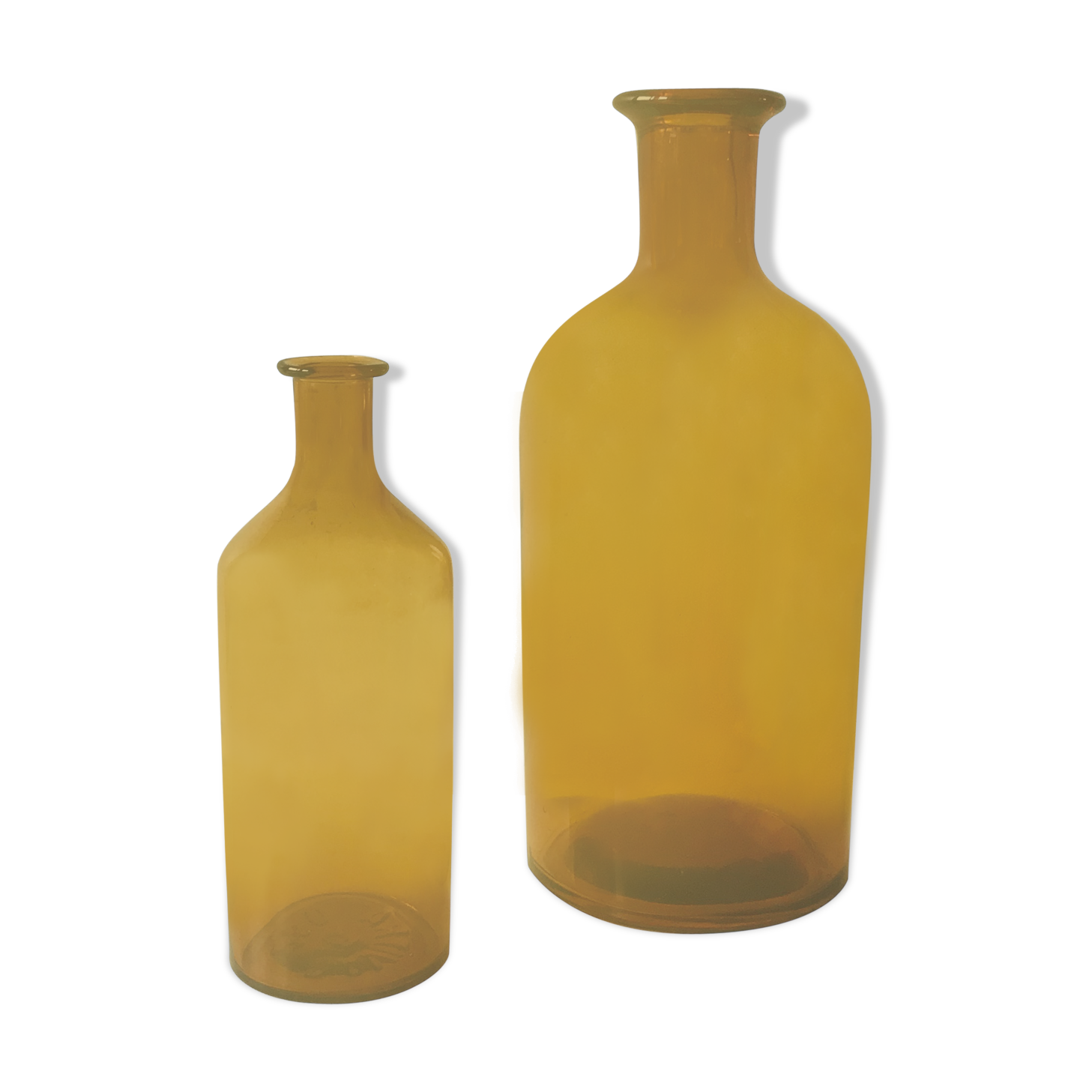 Duo of ancient apothecary flakes in amber glass