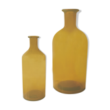 Duo of ancient apothecary flakes in amber glass