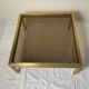 Glass and brass coffee table