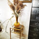 Golden metal side table