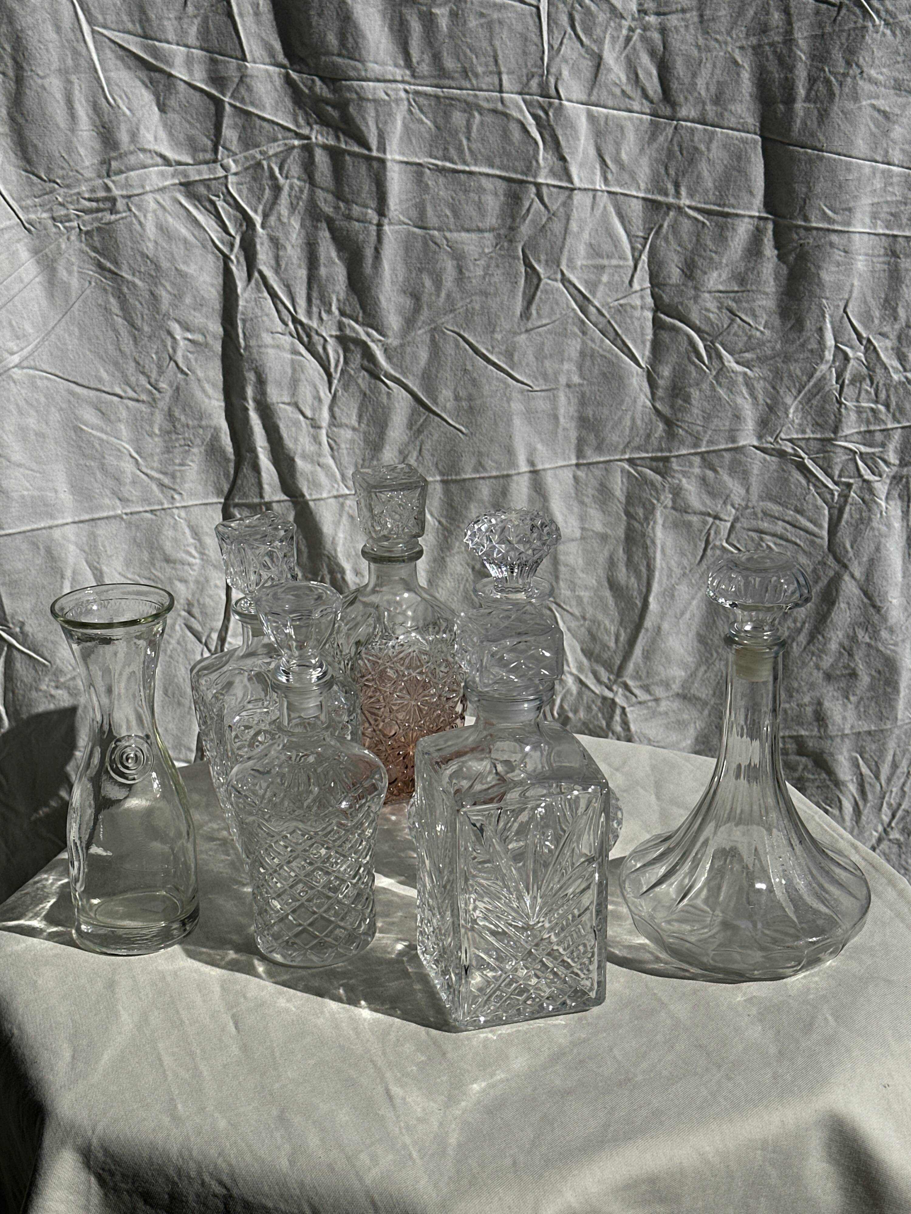 Small cylindrical glass whiskey decanter H:23