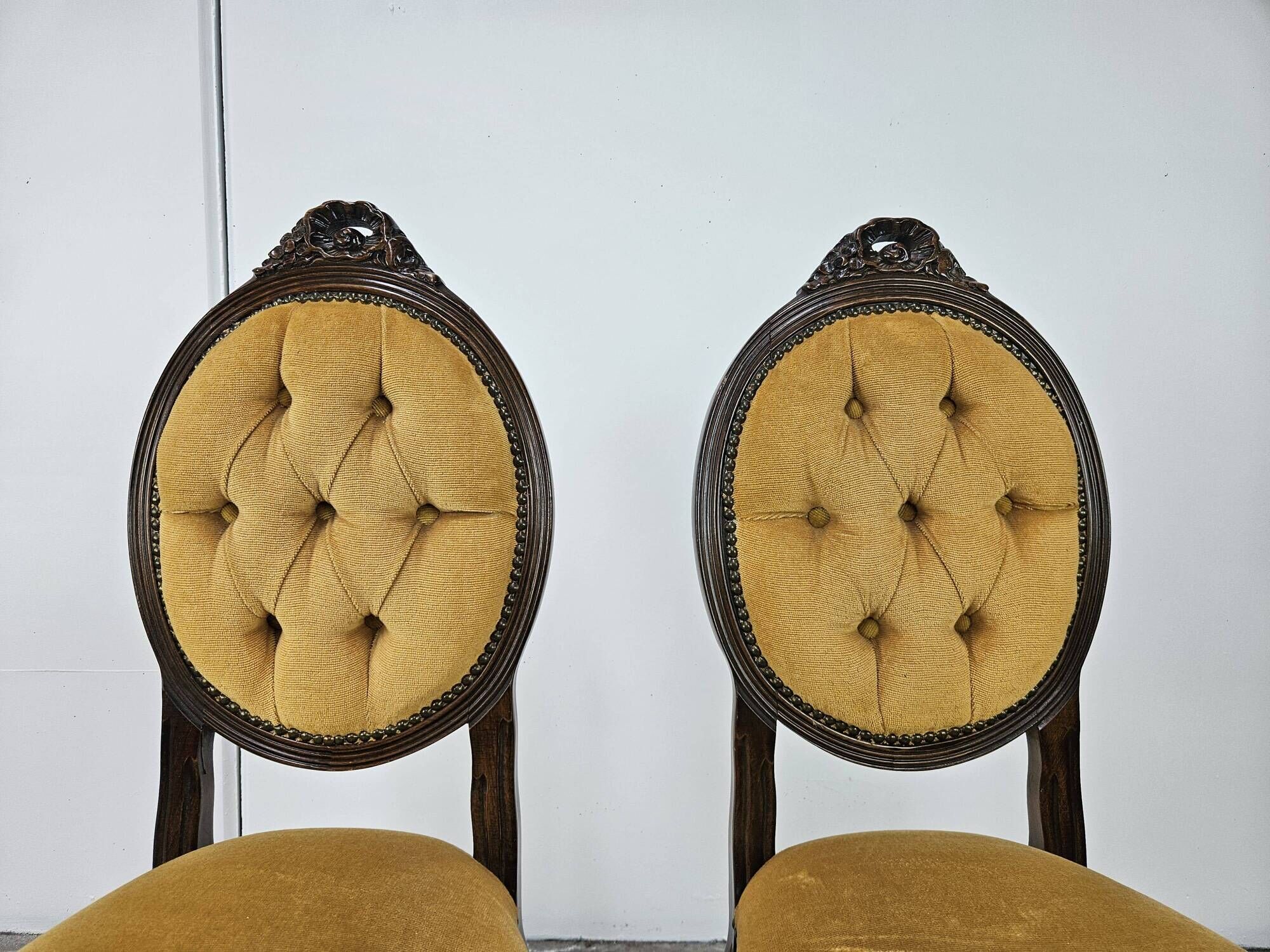 Pair of early 1900s wooden chairs with padded seat and backrests