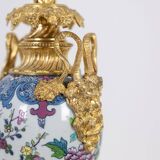 Pair of porcelain lamps decorated with bronze satyrs. Circa 1880.