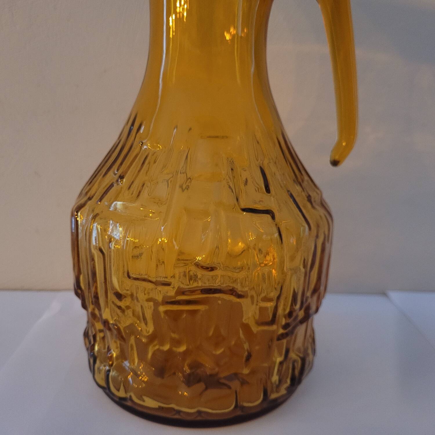 Amber relief glass pitcher. 1970s